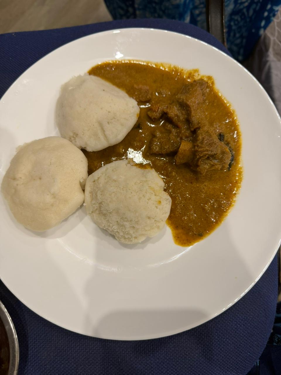 A simple, balanced plate of idli with a protein-rich curry, managed on a busy working day abroad
