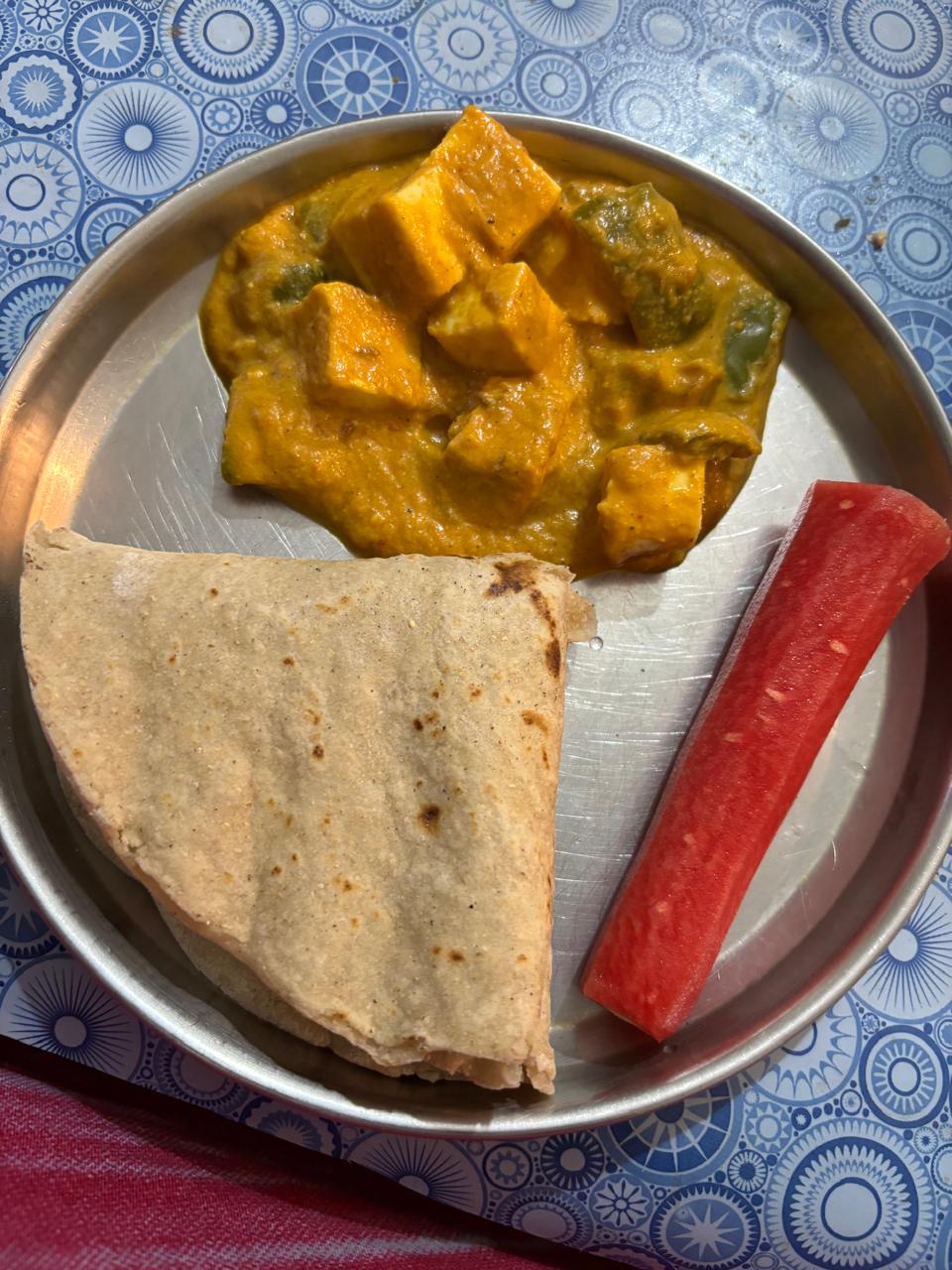 Balanced meal plate: roti with paneer capsicum curry and watermelon slices
