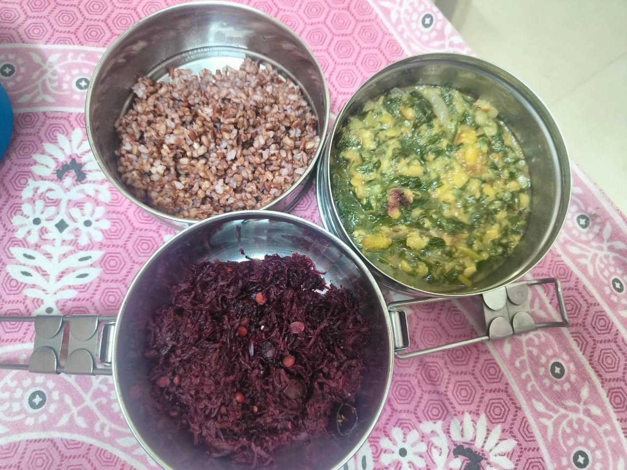 Dr. Anitha's packed tiffin: red rice, spinach dal, and beetroot poriyal