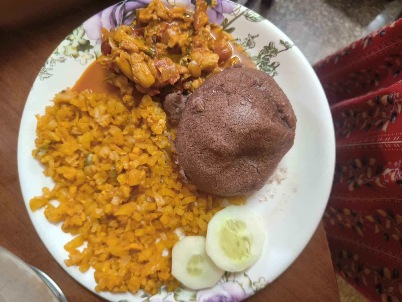 A balanced home plate with ragi kali, a cauliflower-rice poriyal, a mixed vegetable curry and cucumber
