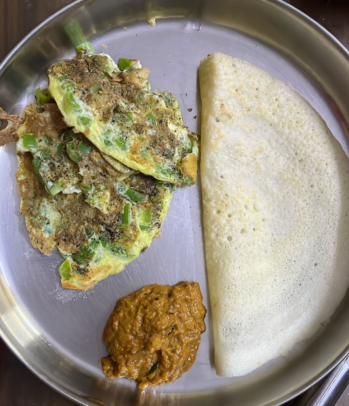 Yamuna's breakfast: dosa with vegetable omelette and chutney, a balanced South Indian meal