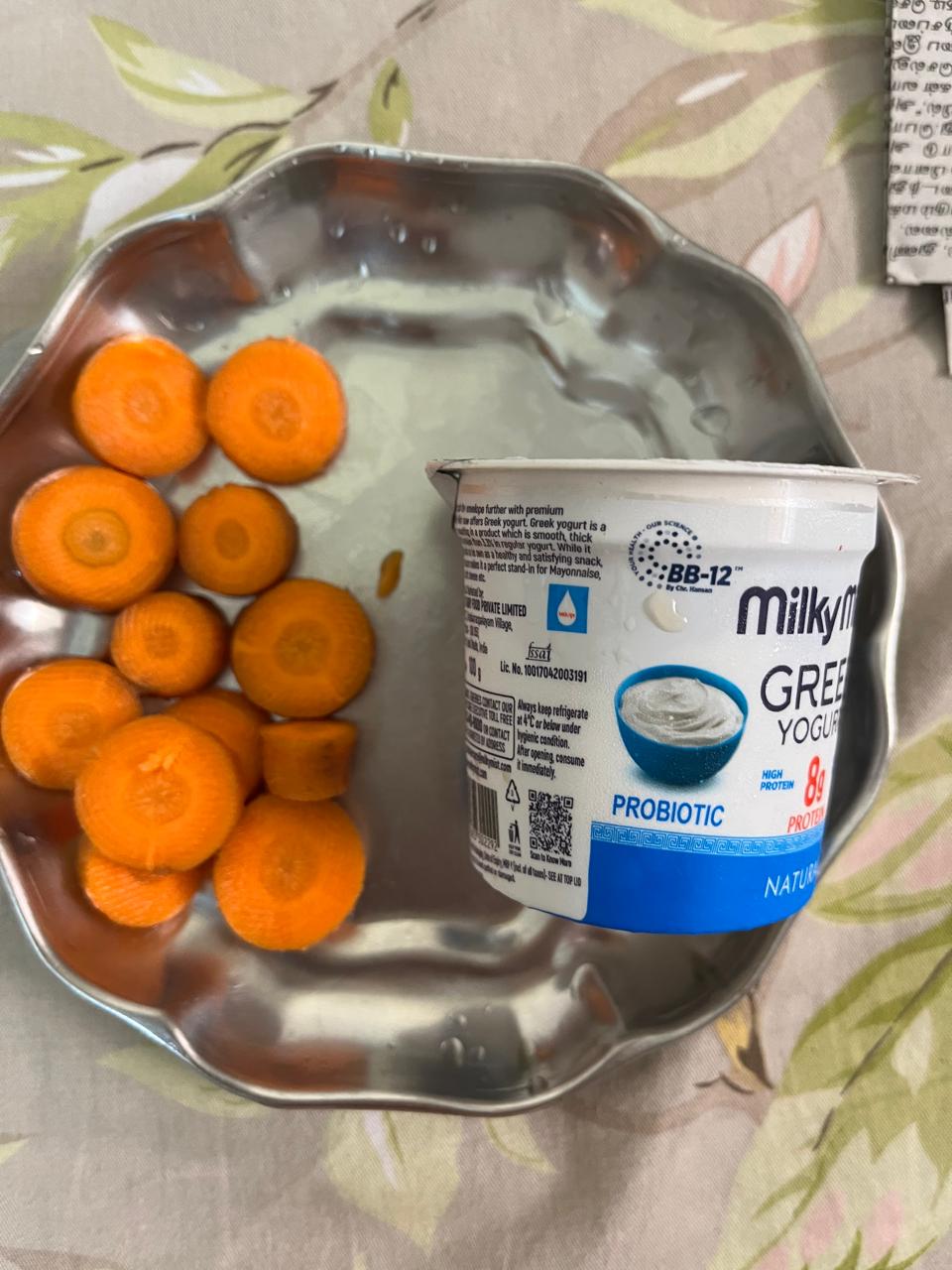 A healthy snack: sliced carrots with probiotic dahi for gut support