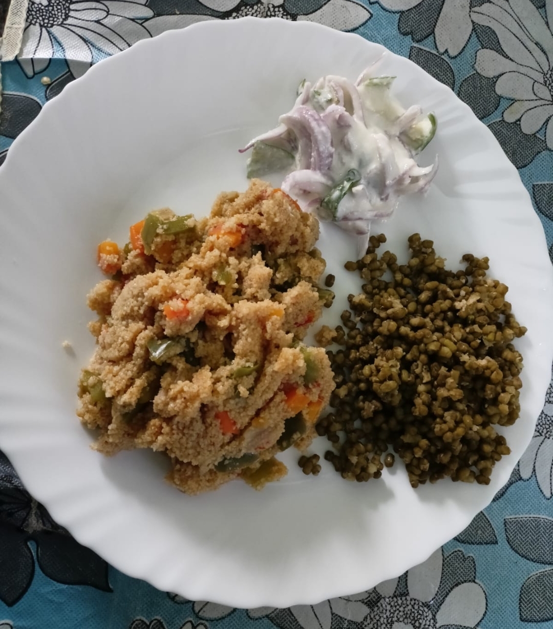 Balanced meal plate: millet upma with vegetables, green moong, and onion raita
