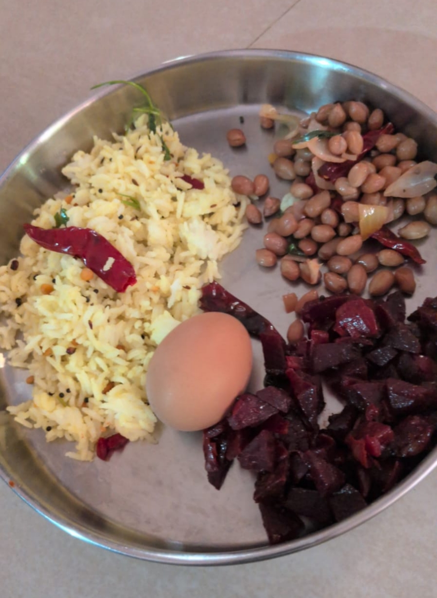 Another meal from Shalini's plan: lemon rice with a boiled egg, beetroot poriyal, and peanut sundal