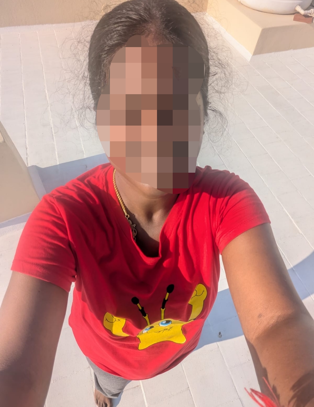 Shalini doing yoga on the terrace, getting early morning sunlight