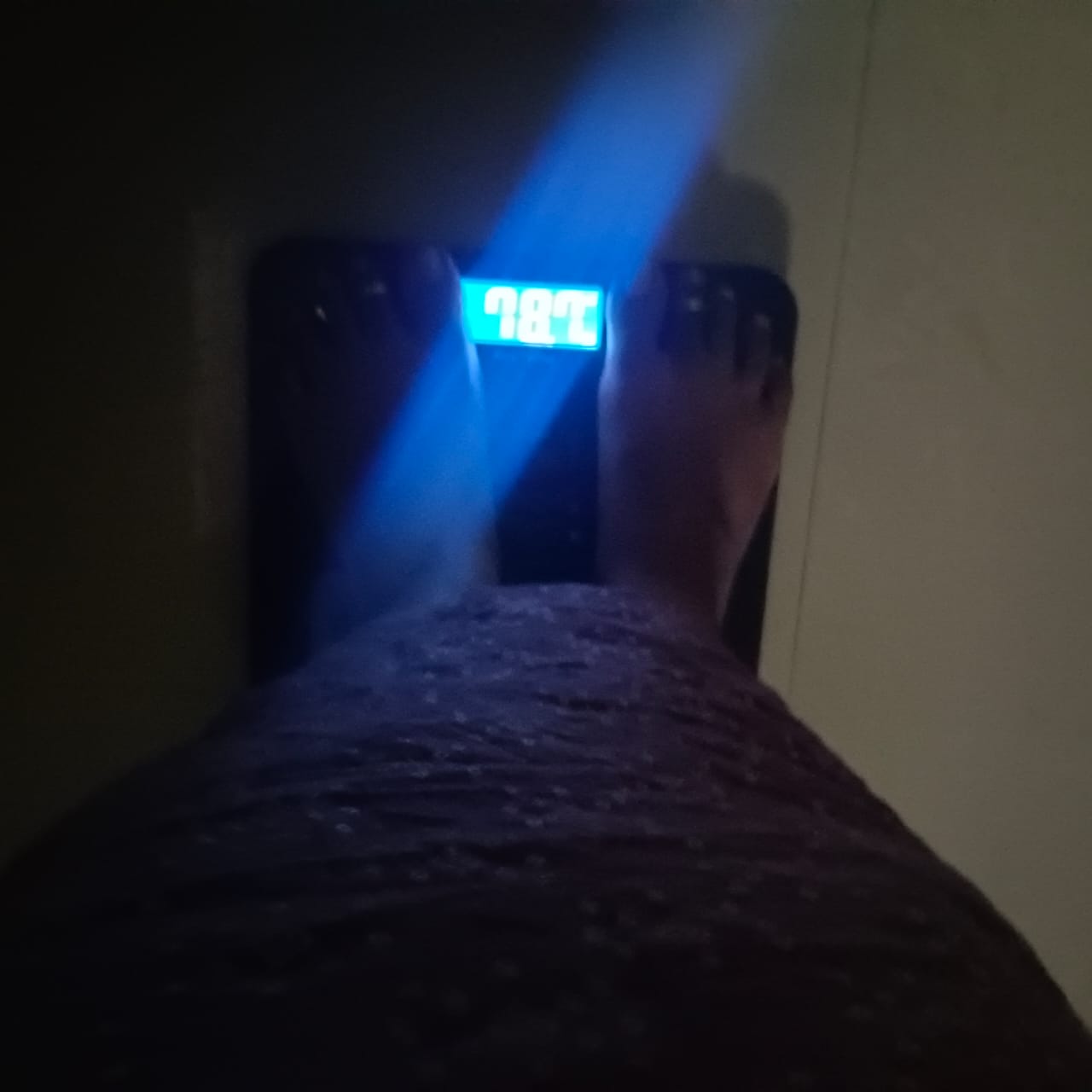 A digital scale reading 78.7 kg, Rani's weight after the program