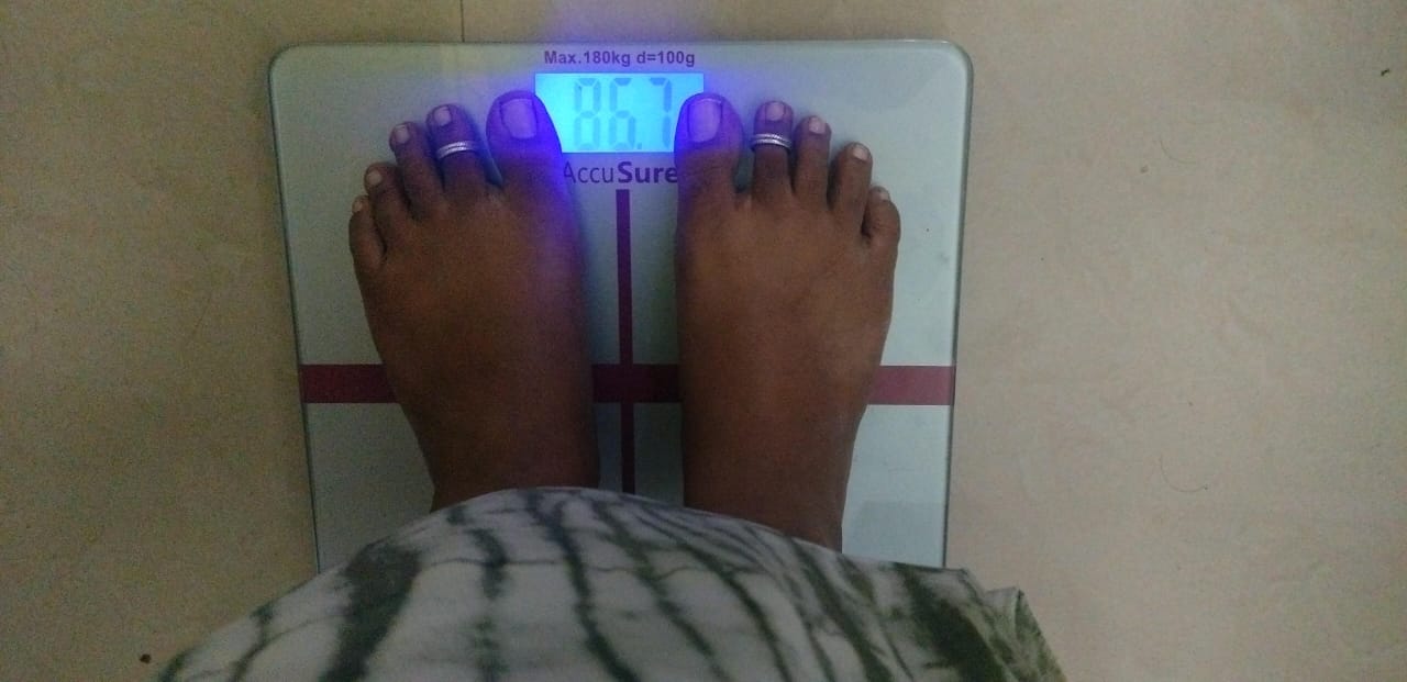 A digital scale reading 86.7 kg, Rani's starting weight