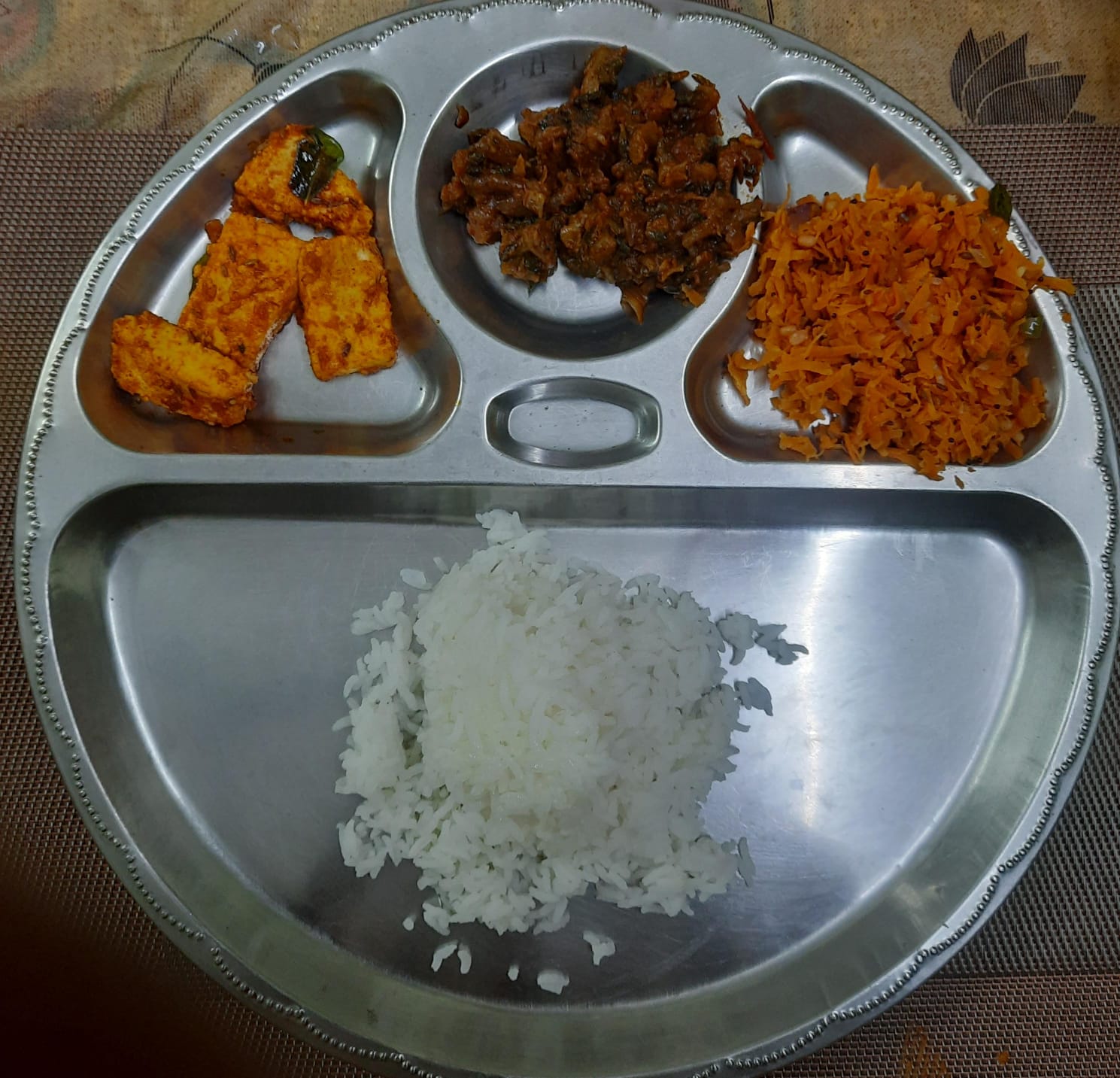 A balanced meal plate from our nutrition plan: rice, paneer, vegetables, and carrot poriyal